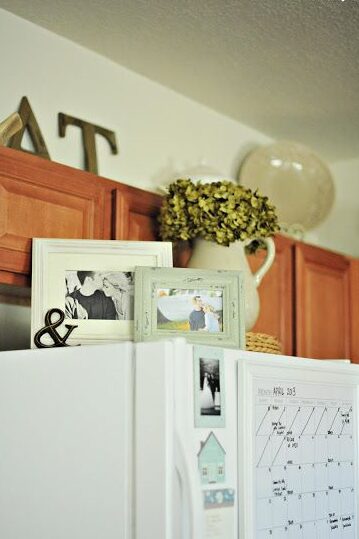 Above the fridge photos