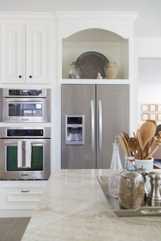 Above the fridge cabinet